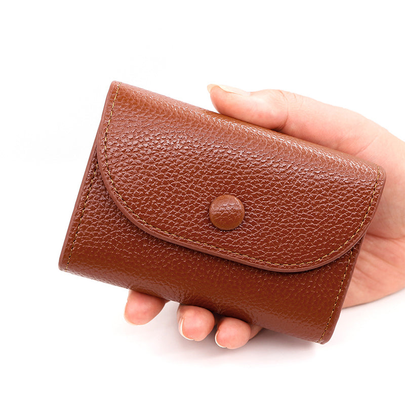 Billetera de moda hecha de cuero PU con patrón de lichi y práctico cierre de botones