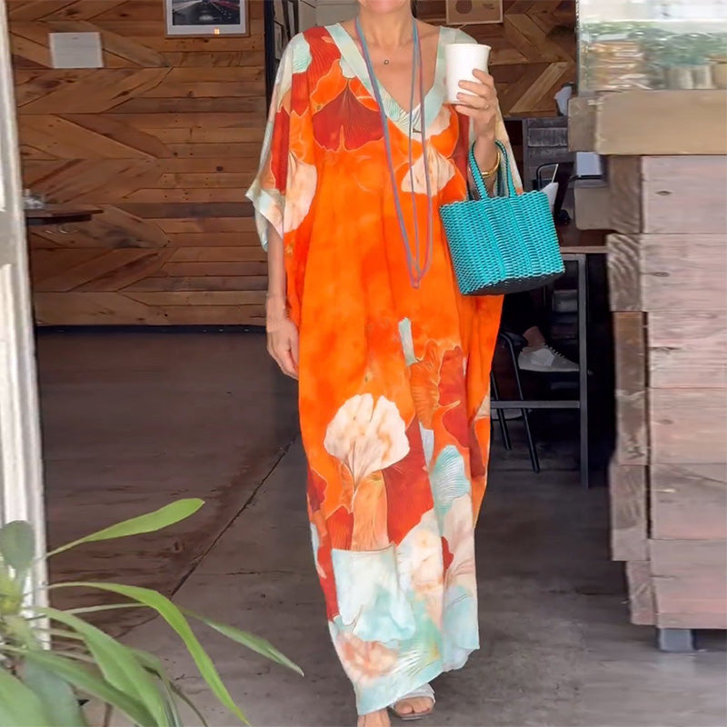 Vestido largo suelto con patrón de flores y medias mangas