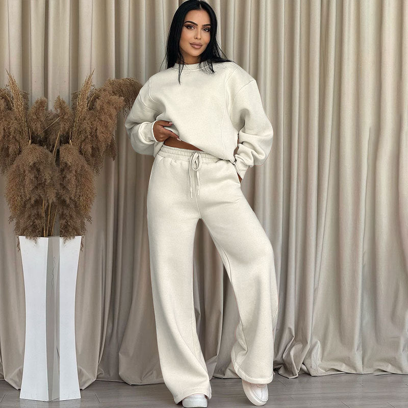 Conjunto de dos partes de moda hecha de top solo con un solo color, suelto y manga larga con un escote circular y pantalones