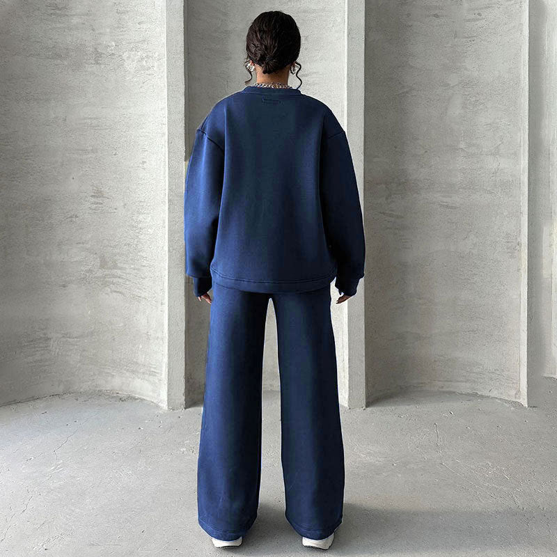 Conjunto de dos partes de moda hecha de top solo con un solo color, suelto y manga larga con un escote circular y pantalones