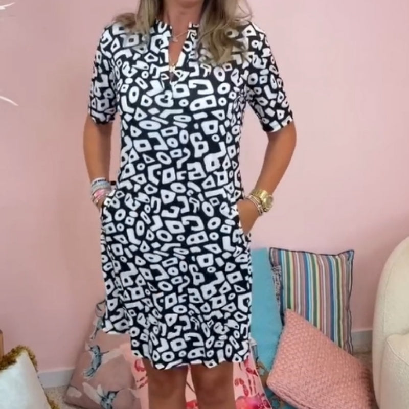 Vestido casual, de manga corta e impresa con un cuello en V para mujeres