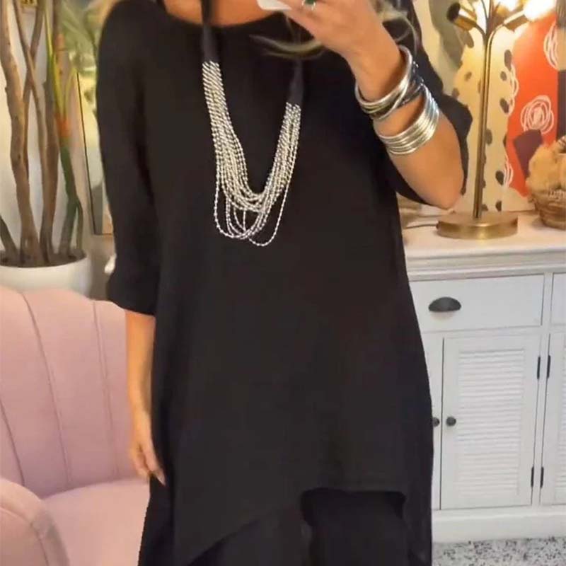 Set de dos partes de las mujeres: tapa asimétrica y pantalones