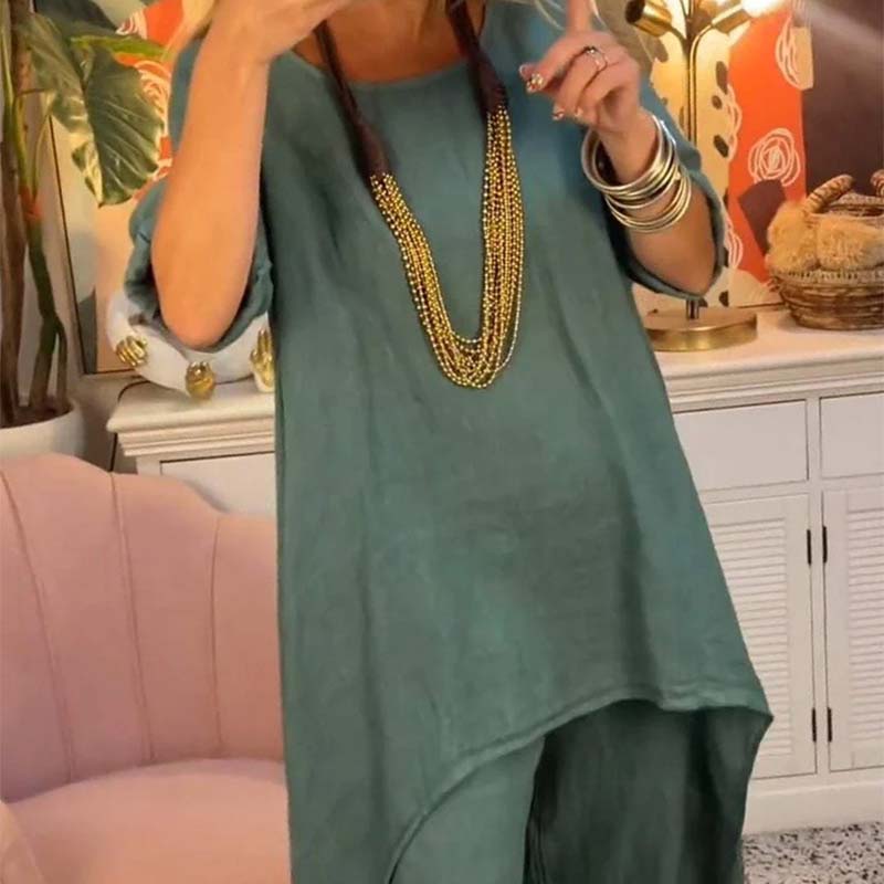Set de dos partes de las mujeres: tapa asimétrica y pantalones