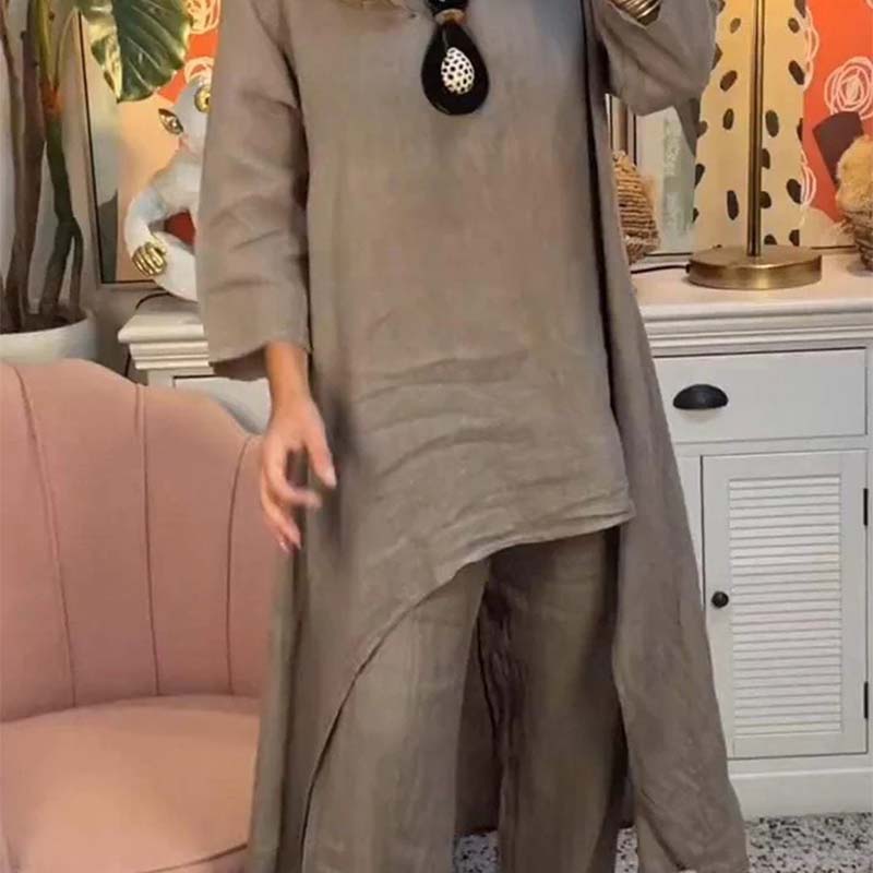 Set de dos partes de las mujeres: tapa asimétrica y pantalones