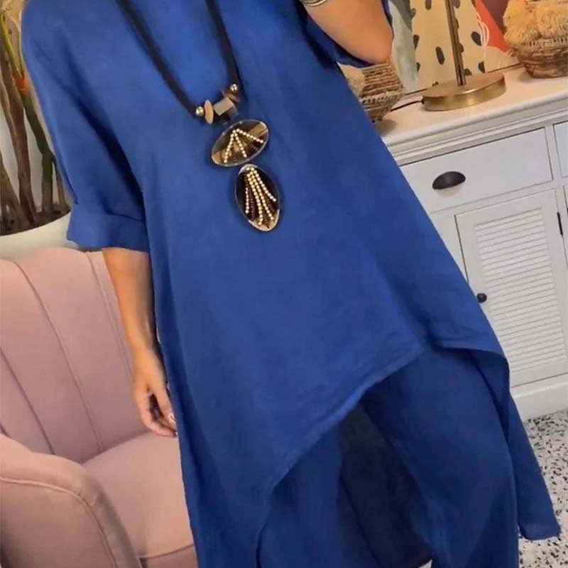 Set de dos partes de las mujeres: tapa asimétrica y pantalones