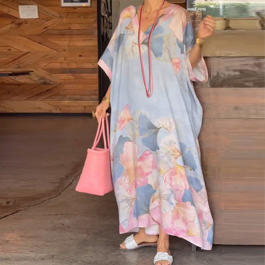 Vestido largo suelto con patrón de flores y medias mangas
