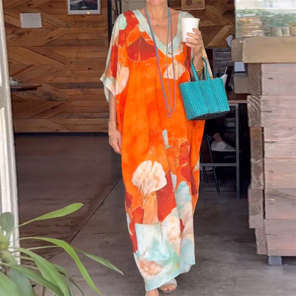Vestido largo suelto con patrón de flores y medias mangas