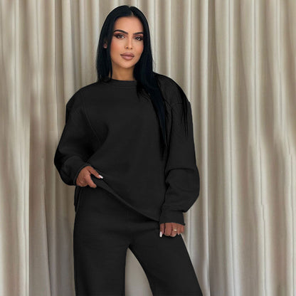 Conjunto de dos partes de moda hecha de top solo con un solo color, suelto y manga larga con un escote circular y pantalones