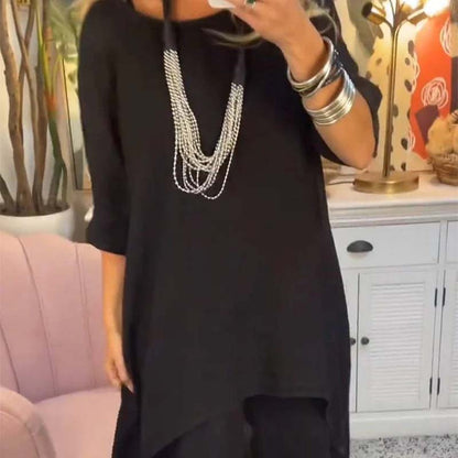 Set de dos partes de las mujeres: tapa asimétrica y pantalones