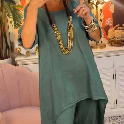 Set de dos partes de las mujeres: tapa asimétrica y pantalones