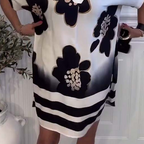 Locker geschnittenes Damenkleid mit Print und tiefem Tunika-Ausschnitt